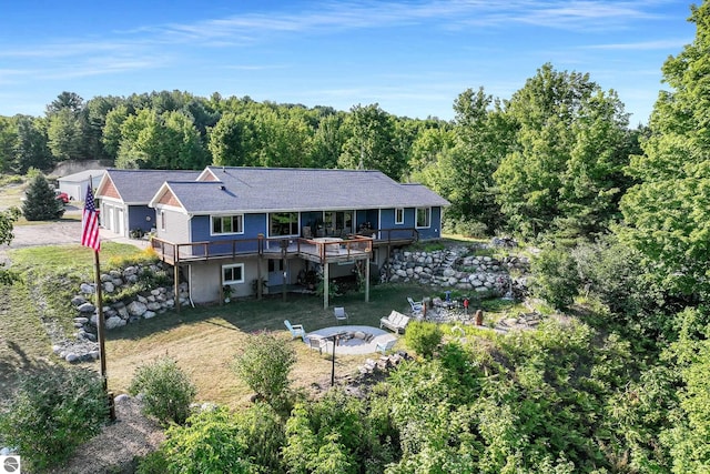 rear view of house featuring a patio and a deck