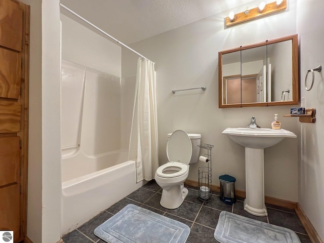 bathroom with tile patterned flooring, shower / bath combination with curtain, a textured ceiling, and toilet