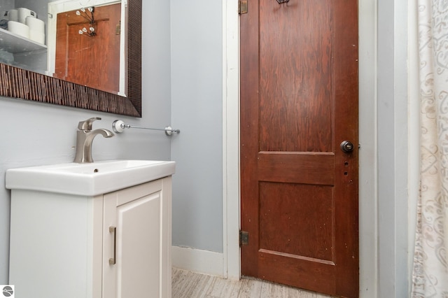 bathroom featuring vanity and hardwood / wood-style floors