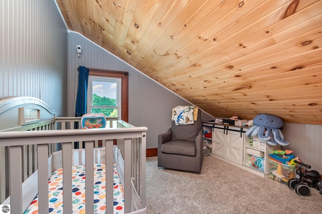 bedroom featuring carpet floors, a crib, wood ceiling, and vaulted ceiling