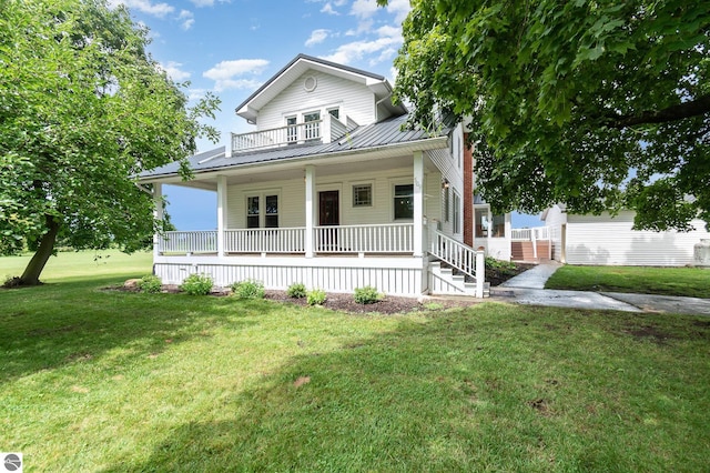 view of front of property with covered porch and a front lawn