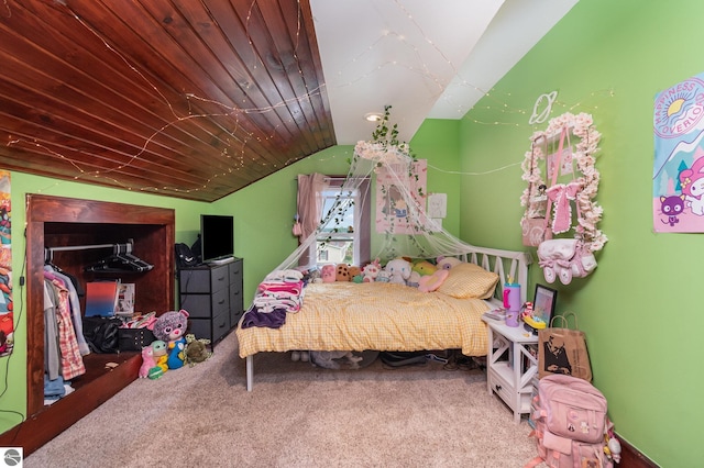 carpeted bedroom with lofted ceiling and wood ceiling