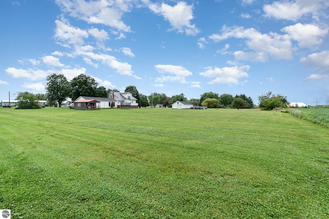 view of yard with a rural view