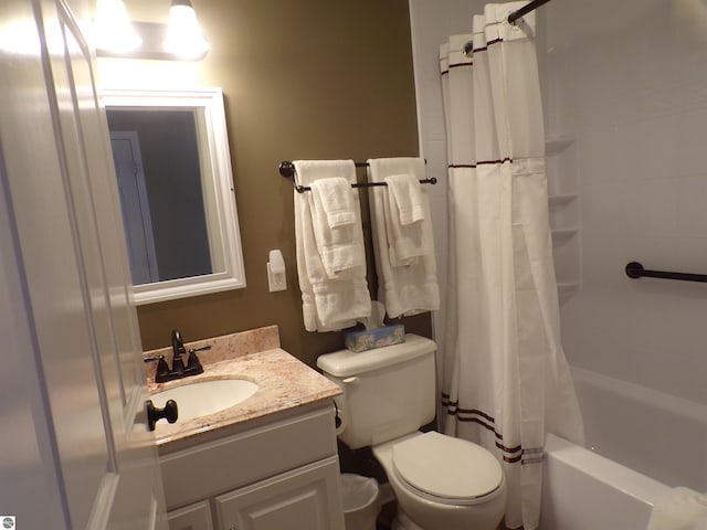 full bathroom featuring shower / bath combination with curtain, toilet, and vanity