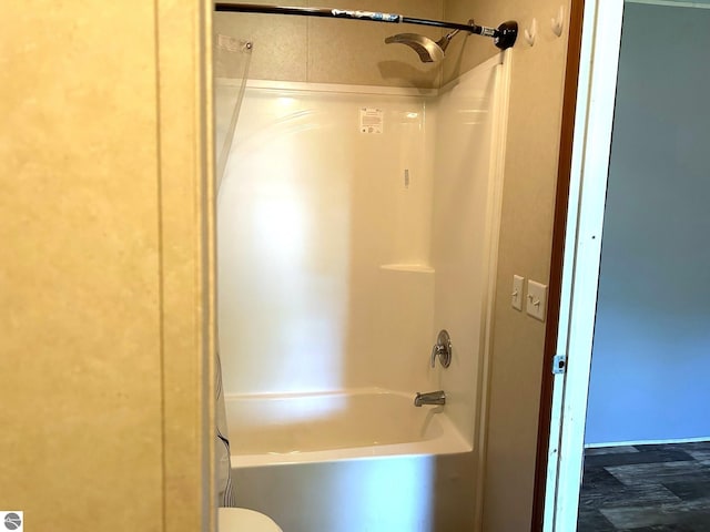 bathroom featuring  shower combination