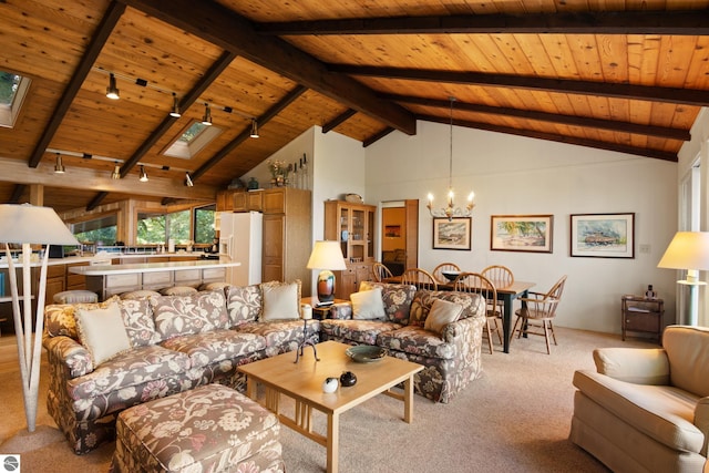 carpeted living room featuring track lighting, a chandelier, a skylight, and wooden ceiling