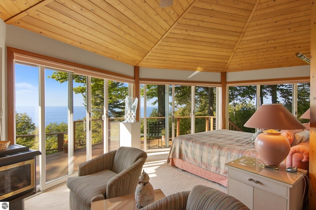 carpeted bedroom with access to exterior, vaulted ceiling, wooden ceiling, and a water view