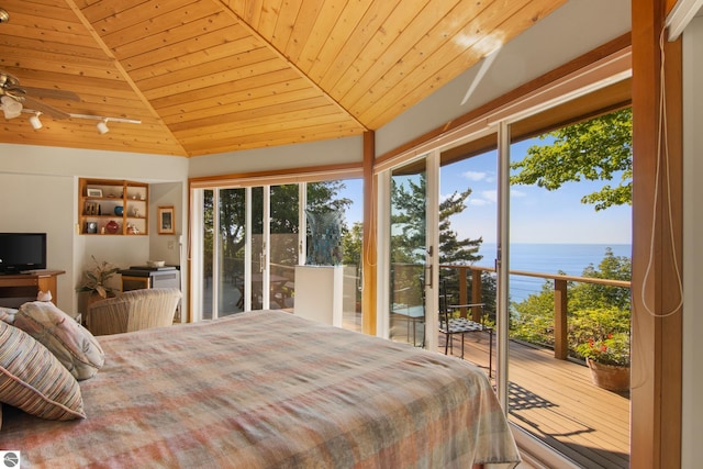 bedroom with a water view, access to outside, and wood ceiling