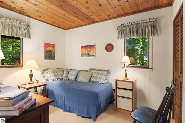 bedroom featuring light carpet and wooden ceiling