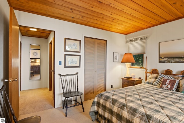 bedroom with light carpet, a closet, and wooden ceiling