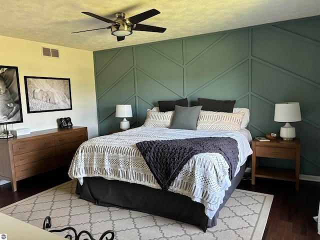 bedroom featuring ceiling fan and wood-type flooring