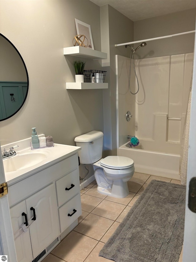 full bathroom featuring tile patterned floors, shower / bath combination with curtain, vanity, and toilet