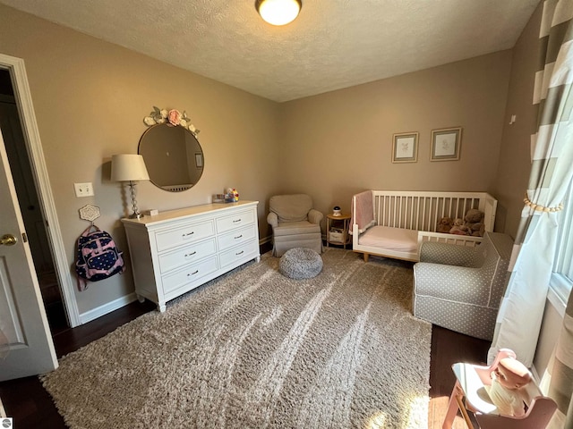 sitting room featuring a textured ceiling and carpet floors