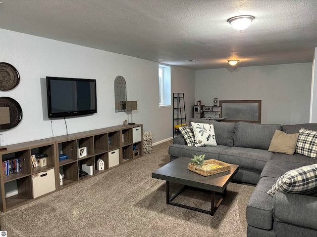 living room featuring carpet and a textured ceiling