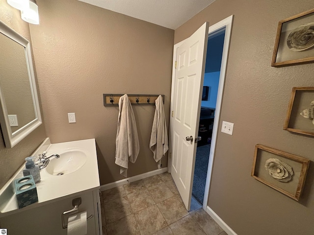 bathroom with vanity and tile patterned floors