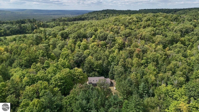 drone / aerial view with a view of trees