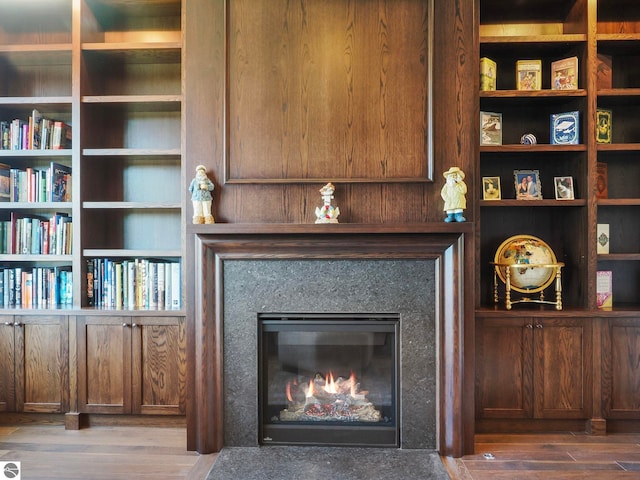 11305 Evergreen, Charlevoix, MI 49720 - detailed view of wood finished floors and a premium fireplace