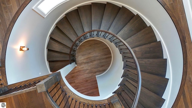 staircase with wood-type flooring