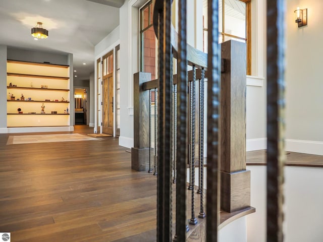 corridor with wood-type flooring