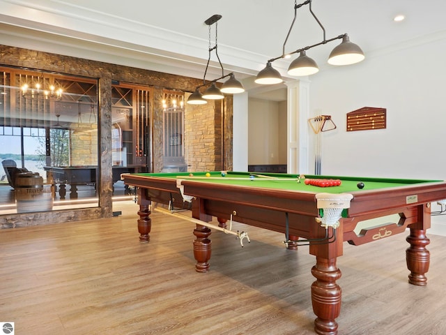 recreation room with billiards, ornamental molding, decorative columns, and light wood-type flooring