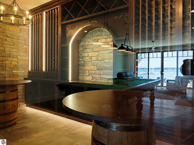 interior space with tile patterned flooring and an inviting chandelier