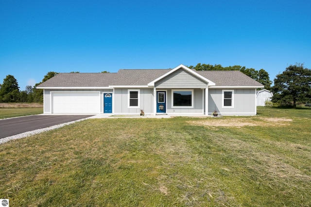 view of front facade with a garage and a front yard