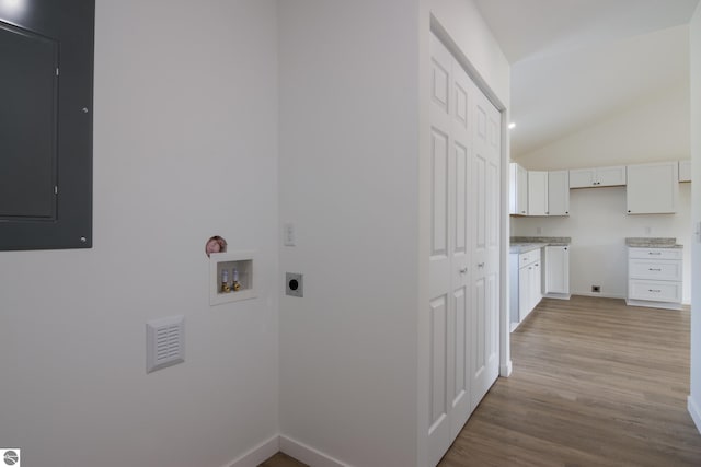 laundry room with hookup for an electric dryer, light wood-type flooring, hookup for a washing machine, and electric panel