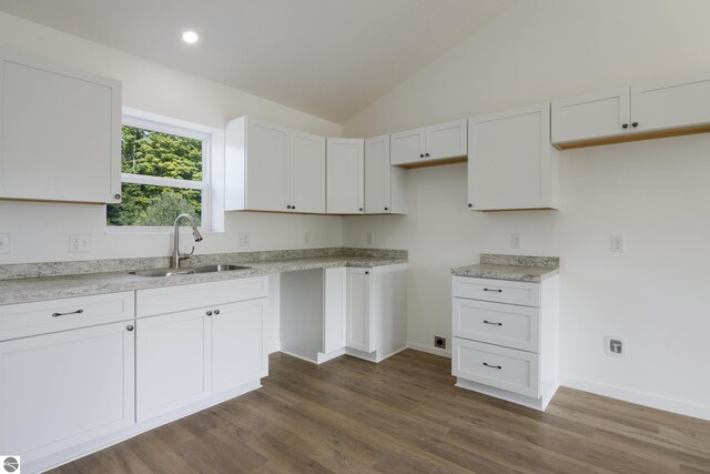 kitchen featuring sink and white cabinetry