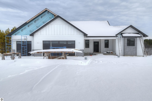 modern farmhouse style home with board and batten siding and an attached garage