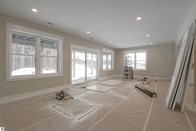 interior space with baseboards, visible vents, and recessed lighting