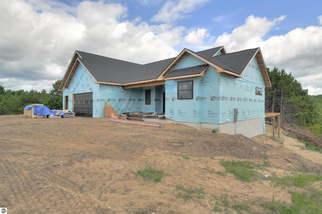 property in mid-construction featuring a garage