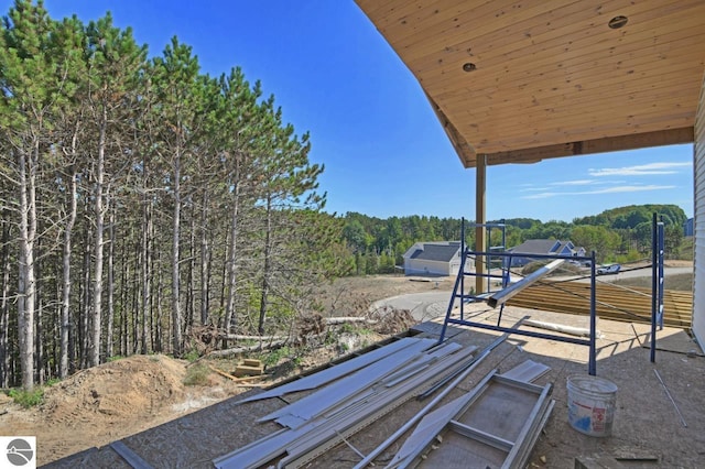 view of patio with a view of trees