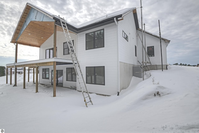 view of snow covered house