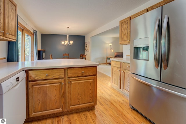 kitchen with dishwasher, an inviting chandelier, hanging light fixtures, light wood-type flooring, and stainless steel fridge with ice dispenser