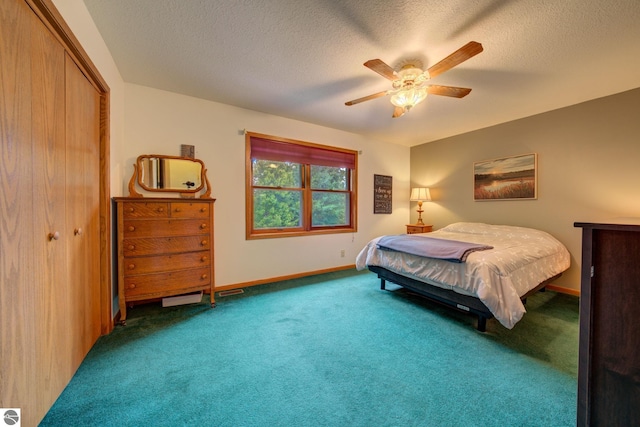 carpeted bedroom featuring a textured ceiling, a closet, and ceiling fan