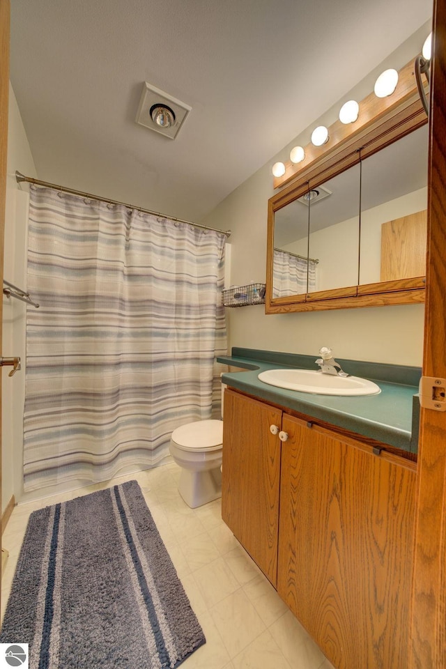 bathroom with vanity and toilet