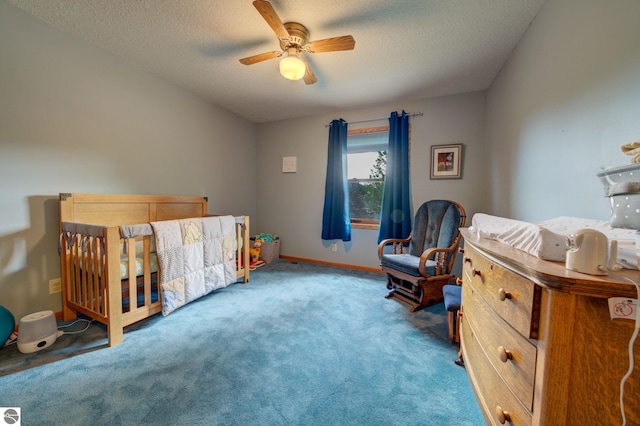 bedroom with carpet, a textured ceiling, and ceiling fan