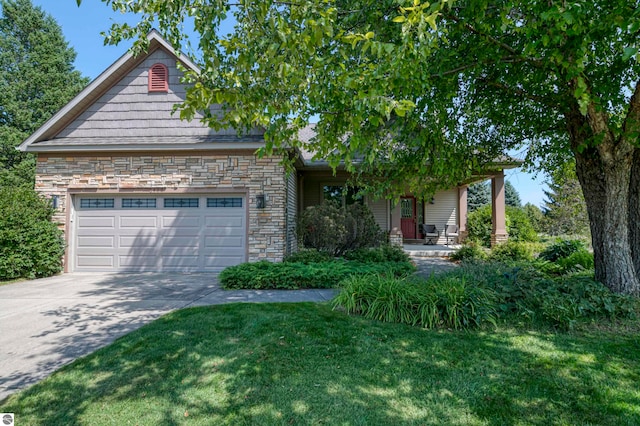 view of front of home with a garage, a porch, and a front yard