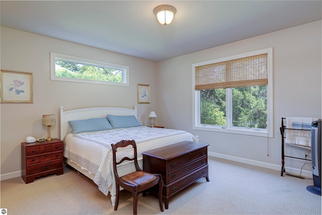 bedroom featuring light colored carpet