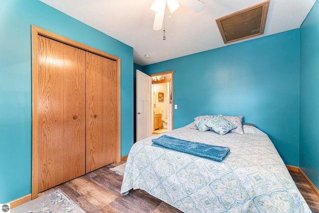 bedroom featuring ceiling fan, a closet, and dark wood-type flooring