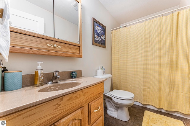 bathroom featuring tile patterned floors, toilet, vanity, and curtained shower