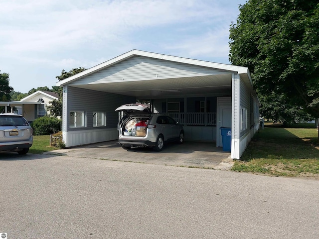 view of front facade with an attached carport and driveway