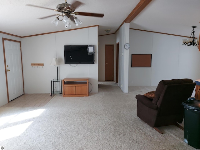 living room with vaulted ceiling with beams, ceiling fan with notable chandelier, ornamental molding, and light colored carpet