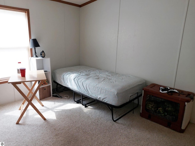 bedroom with light carpet and crown molding