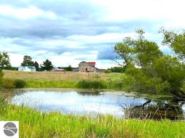 property view of water with a barn