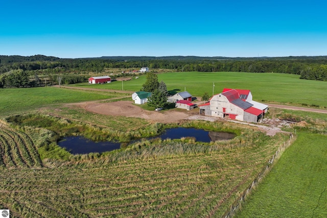 aerial view featuring a forest view and a rural view