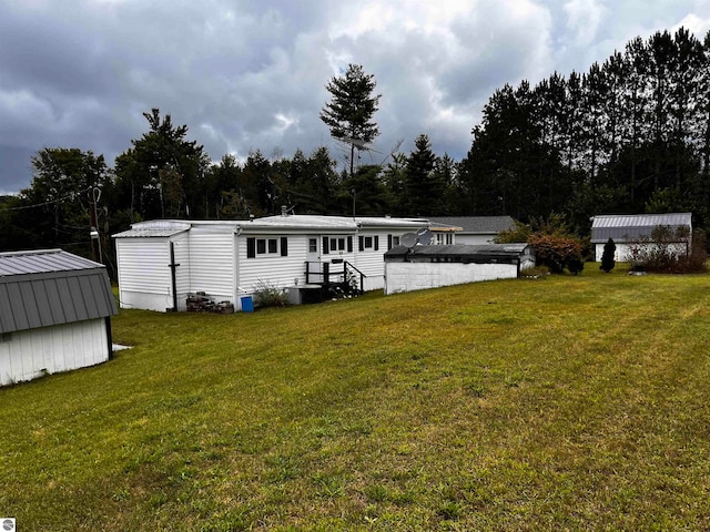 exterior space with a shed and a yard