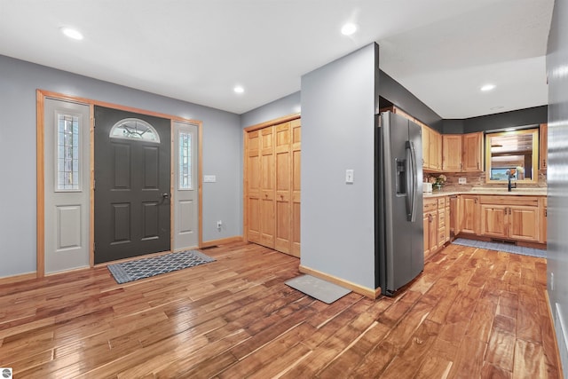 foyer entrance featuring light hardwood / wood-style floors