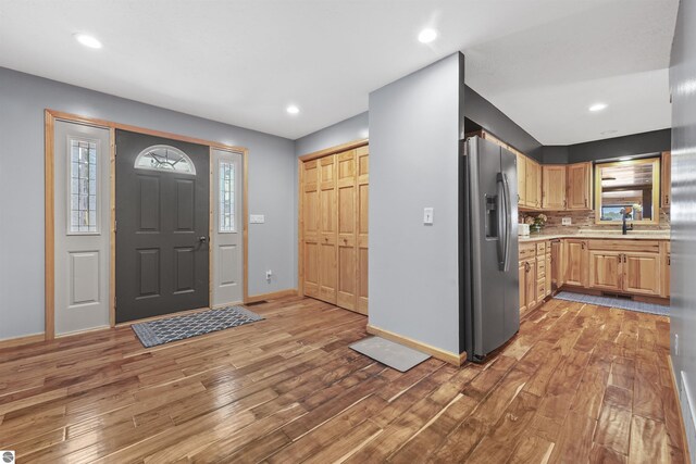 7504 W Dakota Trl, Lake City, MI 49663 - entrance foyer featuring light wood-style floors, baseboards, visible vents, and recessed lighting