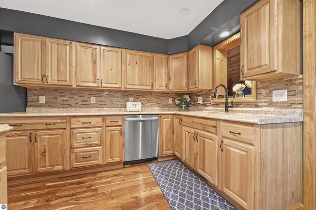 7504 W Dakota Trl, Lake City, MI 49663 - kitchen with decorative backsplash, dishwasher, and light brown cabinets